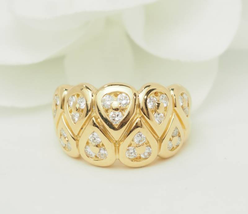 Bague large en or jaune et motifs en forme de gouttes