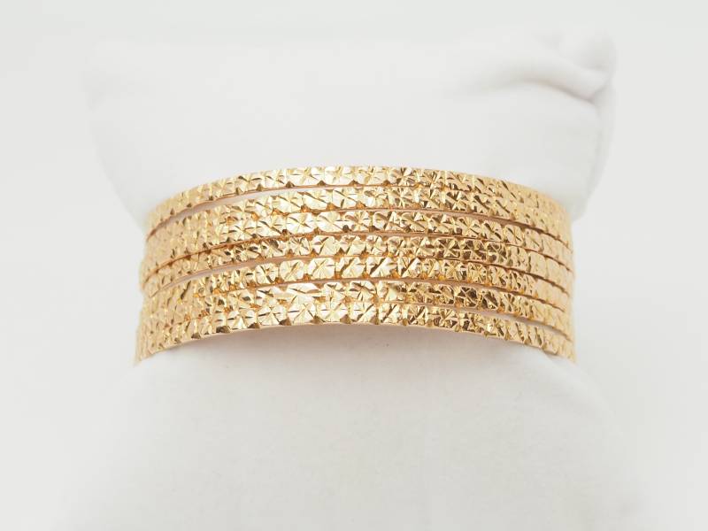 Bracelet semainier ciselé en or jaune 18 carats 75,90 grammes à Marseille